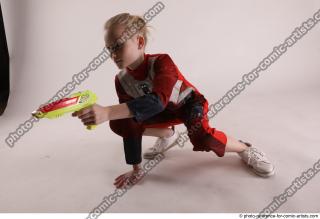 DENISA SITTING POSE WITH GUN